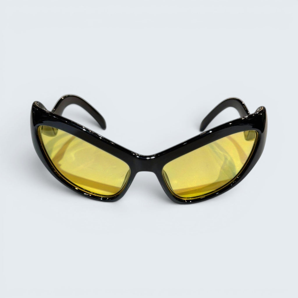 STOXX THRIFT & VINTAGE Eclare sunglasses with a black frame and yellow tinted lenses in a sporty wrap-around style.