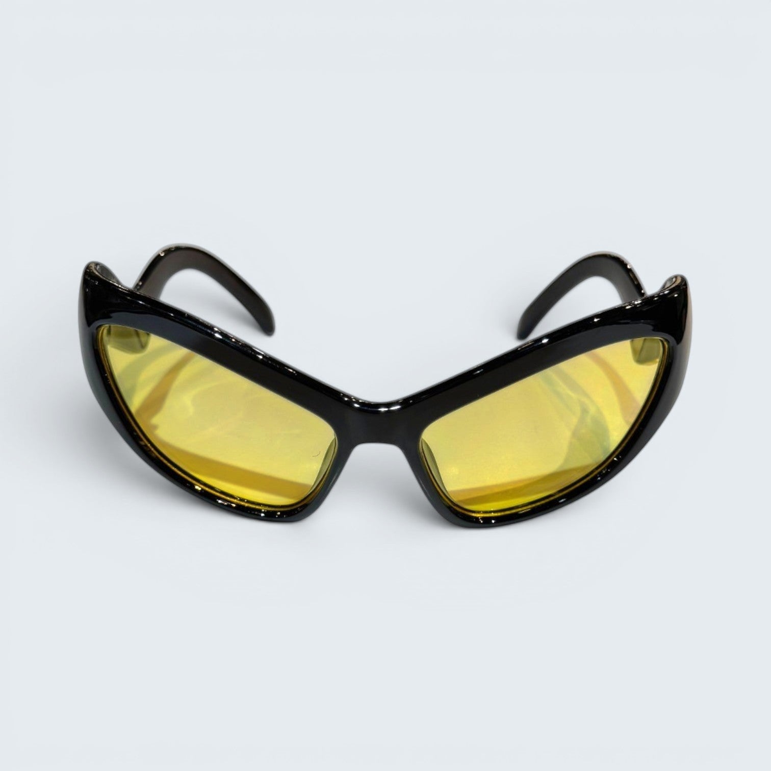 STOXX THRIFT & VINTAGE Eclare sunglasses with a black frame and yellow tinted lenses in a sporty wrap-around style.